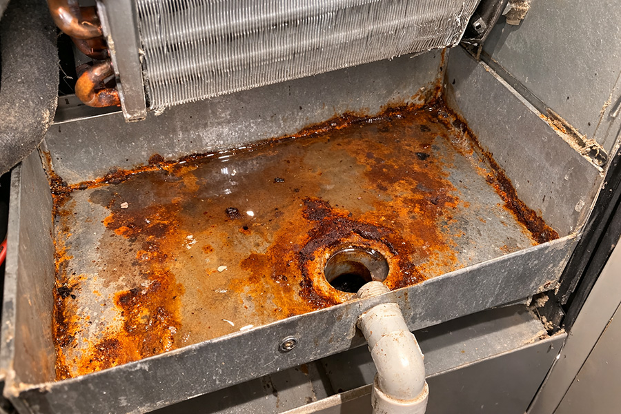 Preparing a damaged drain pan for resurfacing